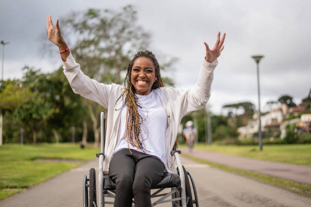 portrait of a woman in a wheelchair in the park.
